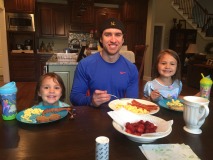 Here I am enjoying a typical meal of eggs and bacon, cooked with butter. The two pretty girls by my side belong to two of my hardest working clients. We work hard and eat well!